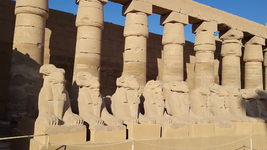 Karnak Temple. Statues of rams of the god Amun Ra. Detailed panoramic view of stone columns and rams. Luxor. Egypt. Royalty-Free Stock Footage #1109467839