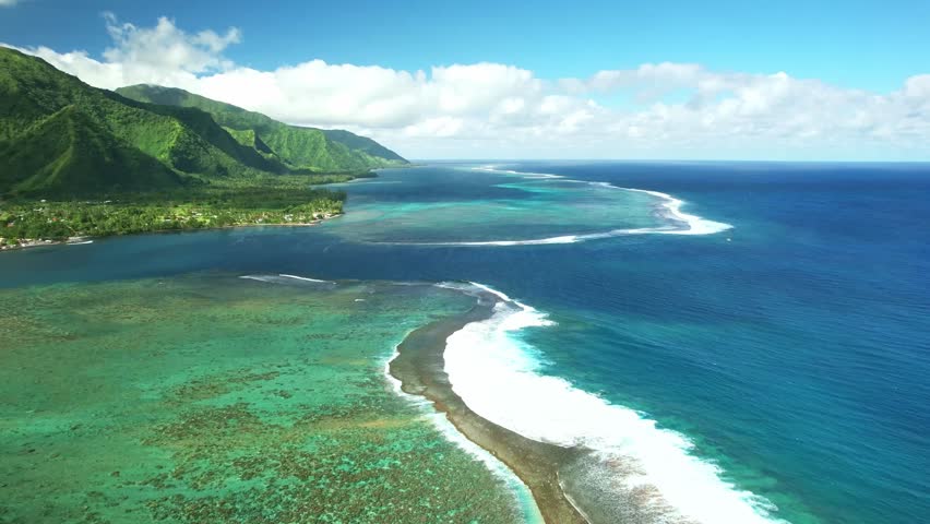 Aerial Tahiti. surfing in Teahupoo. Exotic tropical island, ocean, mountains. Drone  French Polynesia. Teahupoo is a famous surfing destination near Papeete. Adventure travel.  Royalty-Free Stock Footage #1109471245