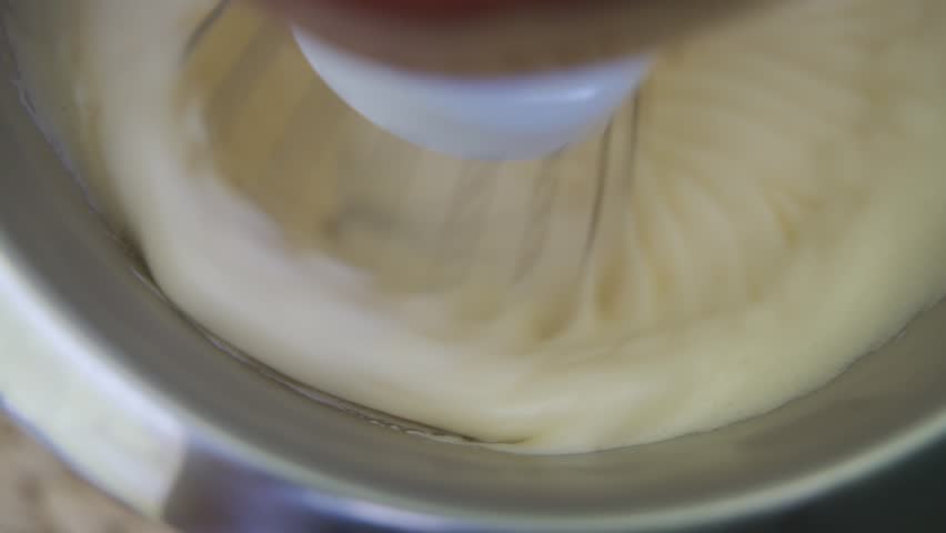 mixing ingredients in a standing kitchen mixer. Preparing delicious cream to make cake. HLG BT.2020 Royalty-Free Stock Footage #1109471279