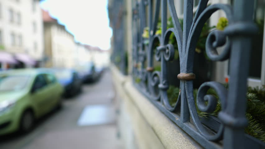 European street sidewalk with elegant protective window gate in foreground Royalty-Free Stock Footage #1109476667