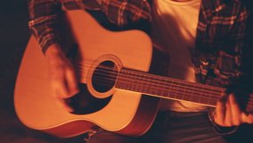 Picnic of young people man and woman with bonfire on beach in the evening. Cheerful friends singing songs playing guitar. Slowmotion shot. Time together at nature, weekend vacation. Summer activity - Powered by Shutterstock - Get 15% off with code: PIKWIZARD15