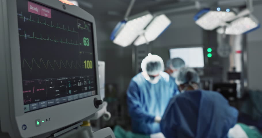 ECG, screen and machine for cardiology in surgery, operation theater or hospital. Heart rate monitor, digital EKG and electrocardiogram of surgeon, people or teamwork in emergency room for healthcare Royalty-Free Stock Footage #1109481541