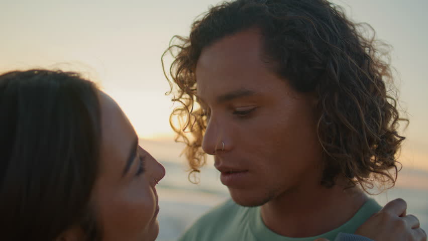 Closeup love couple bonding on sea beach. Passionate girl and guy touching gently. Loving young man kissing girlfriend hands tenderly. Teen lovers enjoying romantic date together on calm ocean coast Royalty-Free Stock Footage #1109483245