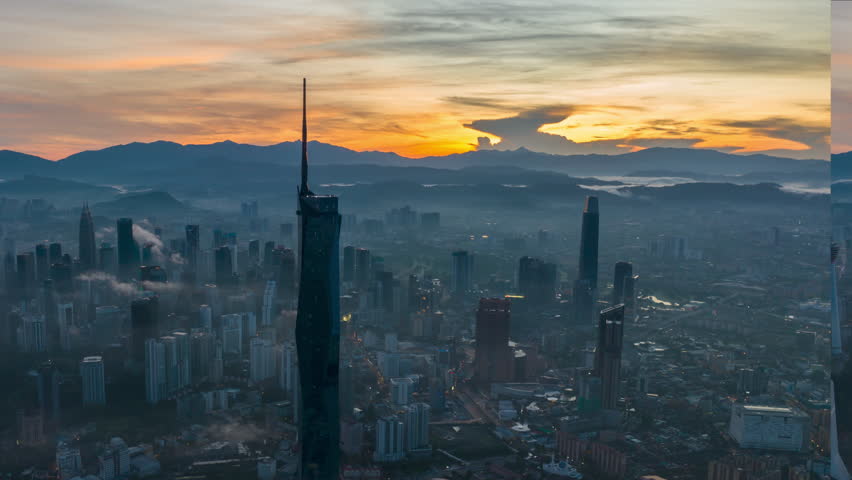 Aerial view hyperlapse 4k video of Kuala Lumpur city center view during dawn overlooking the city skyline in Federal Territory, Malaysia. Pan left Royalty-Free Stock Footage #1109487841