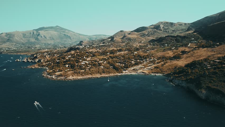 Aerial drone view approaching the beautiful natural reserve of the Zingaro near San Vito Lo Capo in the province of Trapani Royalty-Free Stock Footage #1109488613