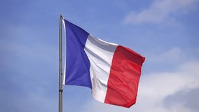 flag of France in front of a blue sky slow motion - Powered by Shutterstock - Get 15% off with code: PIKWIZARD15