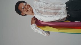 Gender fluid young man wearing fashionable clothes posing in studio on colored backgrounds - Powered by Shutterstock - Get 15% off with code: PIKWIZARD15