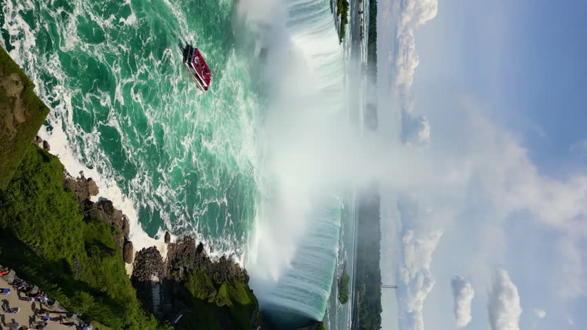 Aerial view of Niagara Falls, USA. A beautiful landscape of a river whose water falls down from a rock on the border of states. High quality 4k footage