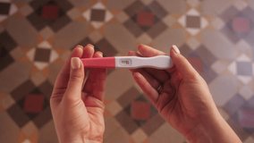 Woman with anxious feelings. Girl with a negative pregnancy test. Close-up of hands holding pregnancy test. - Powered by Shutterstock - Get 15% off with code: PIKWIZARD15