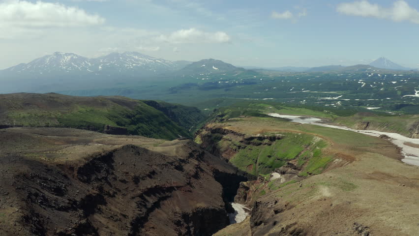 Aerial drone shot of canyon of the Opasny waterfall at the foot of the active Mutnovsky volcano