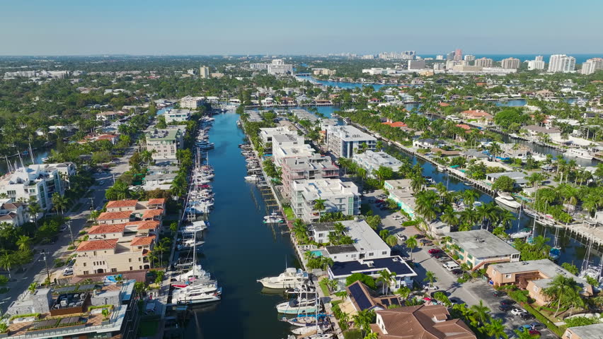 Premium housing development in the USA. Aerial view of expensive waterfront houses between green palm trees in Fort Lauderdale, Florida Royalty-Free Stock Footage #1109500969