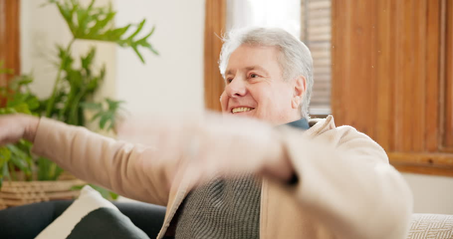 Relax, happy and senior man on sofa in the living room thinking for reflection or memory. Calm, smile and elderly male person in retirement resting and peace in the lounge of his modern home. Royalty-Free Stock Footage #1109501539