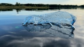 Plastic bottle garbage on sea shore lake. Collecting waste and garbage on beach. Waste Plastic bottle for recycling and re-use. Plastic bottles as pollution. People throws garbage and waste in ocean. - Powered by Shutterstock - Get 15% off with code: PIKWIZARD15