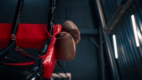 vertical video sports equipment in the gym boxing gloves on the ropes of ring active sports professional training