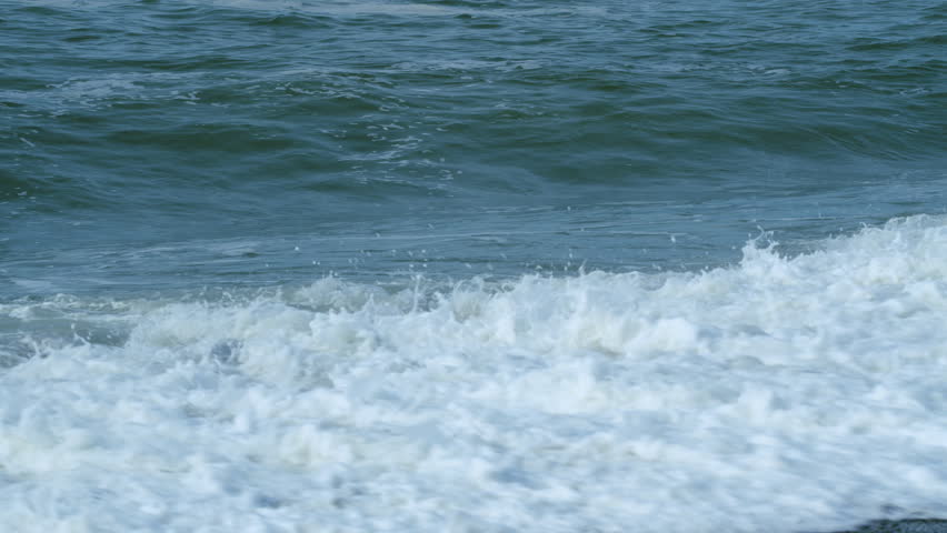 Beautiful Blue Water Of Ocean With Waves. Water Covered By Waves Crashing Into White Sea Foam. Slow motion. Royalty-Free Stock Footage #1109511015