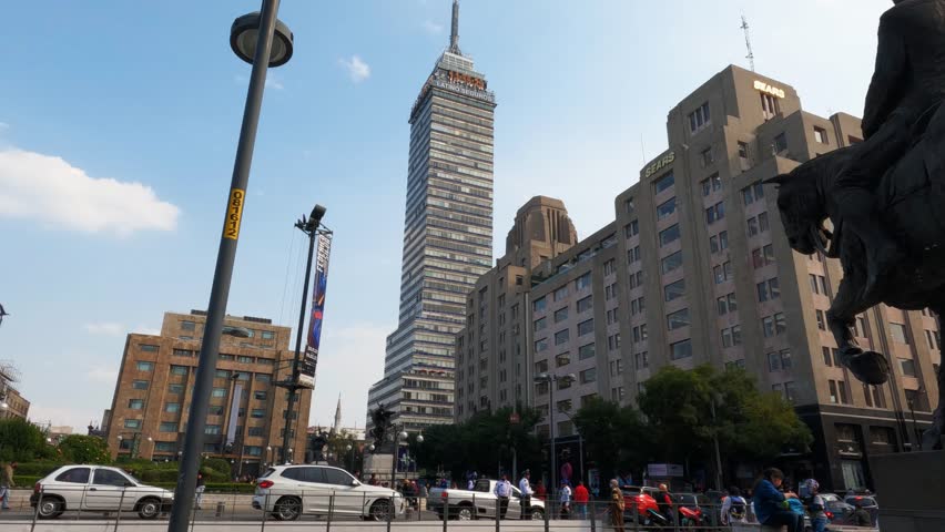 MEXICO CITY, MEXICO - JANUARY 10, 2023: The Torre Latinoamericana, is a skyscraper in downtown Mexico City, situated in the historic city center. Slow motion steadicam footage.