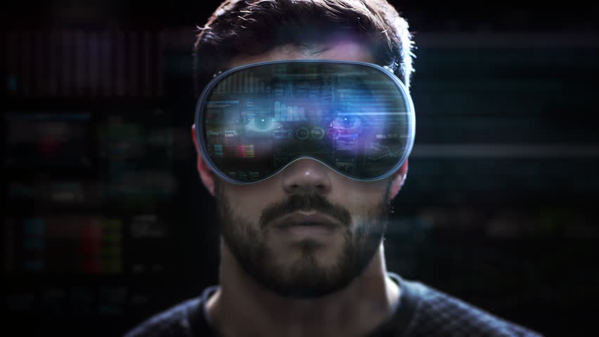 
Young Male Broker using New Futuristic Virtual Reality Glasses to Check Stock Exchange Data. Animated Economy Charts and Graphs. Financial Advisor Working With Augmented Reality Headsets. - Powered by Shutterstock - Get 15% off with code: PIKWIZARD15