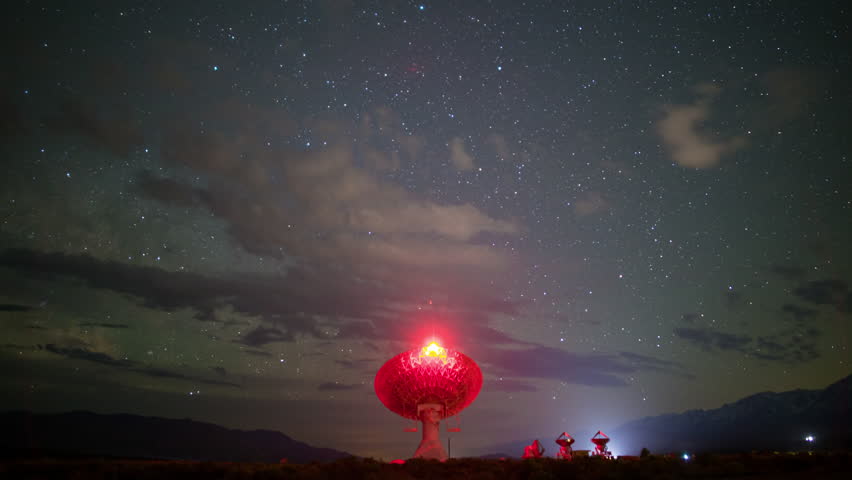 Timelapse of Milky Way galaxy rising over Large Parabolic Antenna at Owens Valley Radio Observatories in California, USA