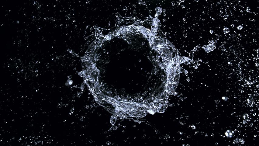 Super Slow Motion Shot of Rotating Water Ring Moving Towards Camera at 1000fps.