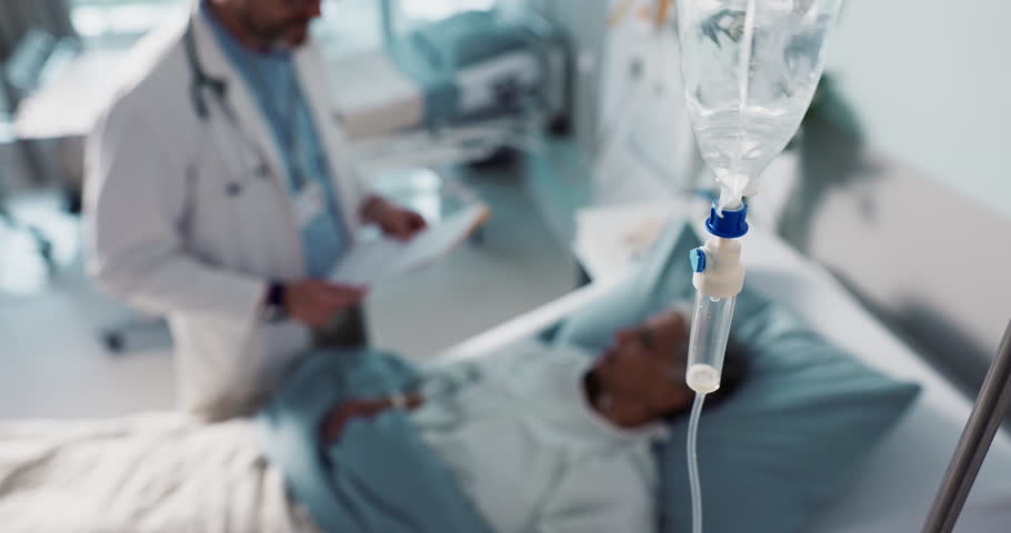 IV drip, healthcare and medicine with doctor and patient in hospital, treatment and surgery with healing. People at clinic, health with medication or liquid in bag for infusion, service and recovery
