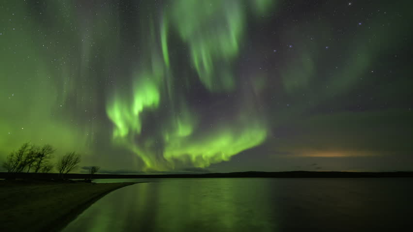 Beautiful Aurora Borealis in the sandy lake bay