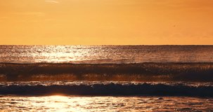 Tropical golden sunrise over ocean waves, morning view of sea horizon video 