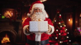 Portrait of a Happy Santa Claus Offering Beautifully Wrapped White Gift To Children. Old Man Looking at Camera, Smiling While Giving the Present Away. Concept of Christmas and New Year's Celebrations - Powered by Shutterstock - Get 15% off with code: PIKWIZARD15