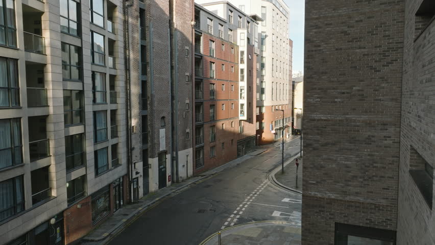 Elevated sweep of Liverpool's bustling city center and hidden alleys.
 Royalty-Free Stock Footage #1109541351