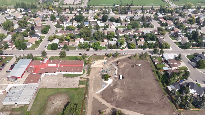 Discover Parkridge, a cozy neighborhood in Saskatoon, Saskatchewan, from an aerial vantage. This drone footage highlights the area