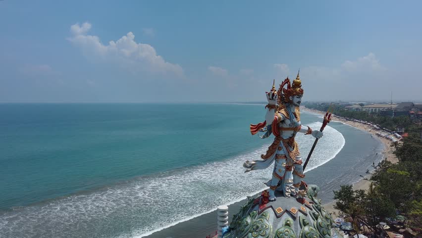 Flying around sculptures on the seashore. Bali
