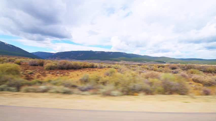 Cottonwood pass, Colorado pov point of view car driving vehicle shot in autumn fall with valley, mountains along county road 742