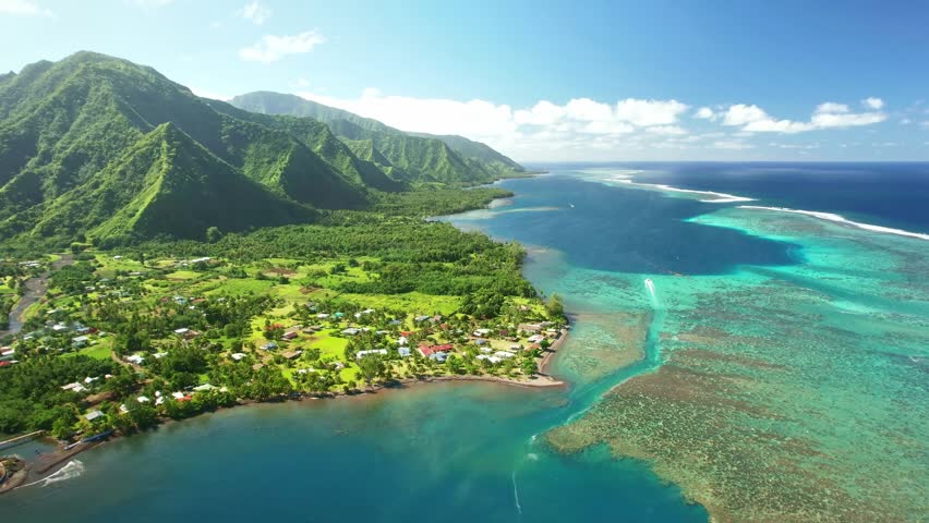 Drone Tahiti. tropical island lagoon, coastal mountains. Aerial view of French Polynesia. Teahupoo is a famous surfing destination near Papeete. Adventure travel.  Royalty-Free Stock Footage #1109561399