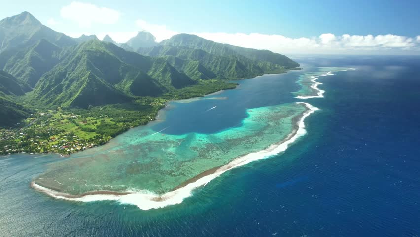 Drone Tahiti. Aerial view surf wave. Exotic tropical island, ocean lagoon, mountains in French Polynesia. Teahupoo is a famous surfing destination. Adventure travel.  Royalty-Free Stock Footage #1109561419