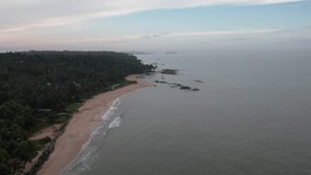 Kerala nature drone video awesome beach aerial view with coconut trees, Travel and tourism concept footage