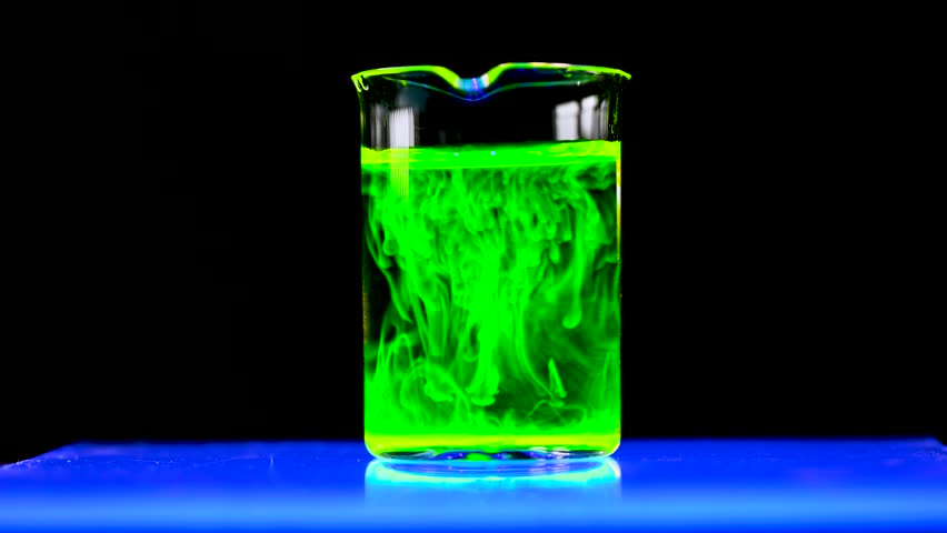 Fluorescent toxic substance dissolving in the chemical solution. The scientist conducts demonstration experiments with solutions. The phenomenon of brownian motion fluorescence. | Shutterstock HD Video #1109573369
