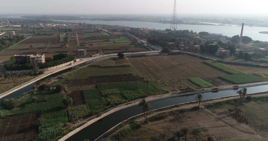 The River Nile of Egypt surrounded by the green lands of the Nile Valley