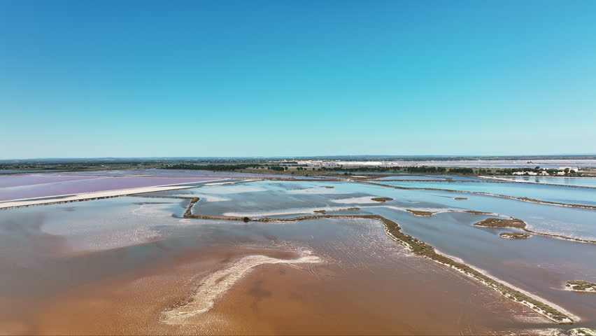 Sky-high view over Aigues-Mortes, revealing the enchanting pink Salin du Midi
