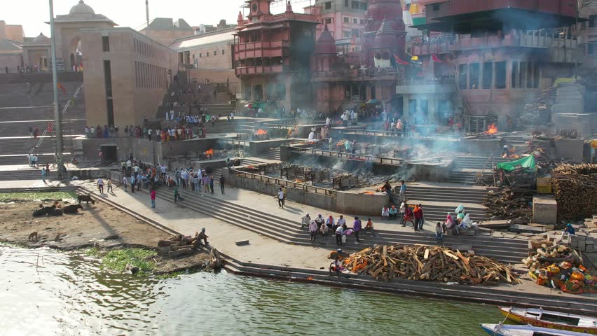 Fire Burial in Varanasi, India on Manikarnika ghat on Ganges River Drone 4K Royalty-Free Stock Footage #1109585249