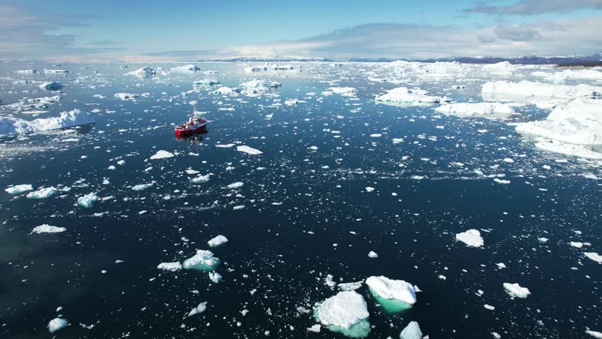 Scientist ship in ocean with flowing iceberg in Greenland, aerial view Royalty-Free Stock Footage #1109590995