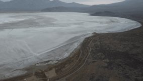High POV panning across the whole salt flats of Lake Salinas Peru