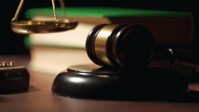 Close up of a judge gavel and a scales of justice. Legal lawyer books or codex. Concept of law or legal system and jurisprudence or court. - Powered by Shutterstock - Get 15% off with code: PIKWIZARD15