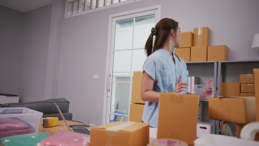 Youth Asia lady owner small business online shop sit front of computer to taking online order Shipping and delivery concept. Royalty-Free Stock Footage #1109600601