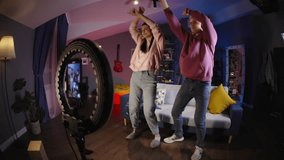 Amateur bloggers have fun recording videos. Incredible charisma and charm of man and woman during captivating dance won hearts of social media users with simplicity vivid openness sincerity lightness - Powered by Shutterstock - Get 15% off with code: PIKWIZARD15