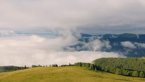 4k drone forward video (Ultra High Definition) of foggy mountain valley. Astonishing summer scene of Carpathian mountains, Ukraine, Europe. Beauty of nature concept background.