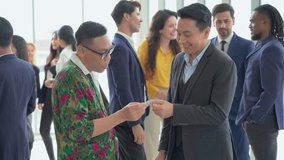 group of diversity business people shaking hands and greeting each other Exchanging Business Cards after a meeting conference or seminar. Communication in Corporate at office. connecting people. asian - Powered by Shutterstock - Get 15% off with code: PIKWIZARD15