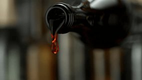 Super Slow Motion of Pouring Red Wine With Camera Motion. Filmed on High Speed Cinema Camera, 1000 fps. Camera Follows the Stream into Glass. Speed Ramp Effect. - Powered by Shutterstock - Get 15% off with code: PIKWIZARD15