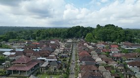 Stunning high quality aerial video of the villages of Bali (Asia, Indonesia). 4k aerial shots of villages, houses, sea, vegetation, rainforest. Touristic typical village.