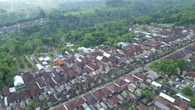 Stunning high quality aerial video of the villages of Bali (Asia, Indonesia). 4k aerial shots of villages, houses, sea, vegetation, rainforest . Beautiful typical village.