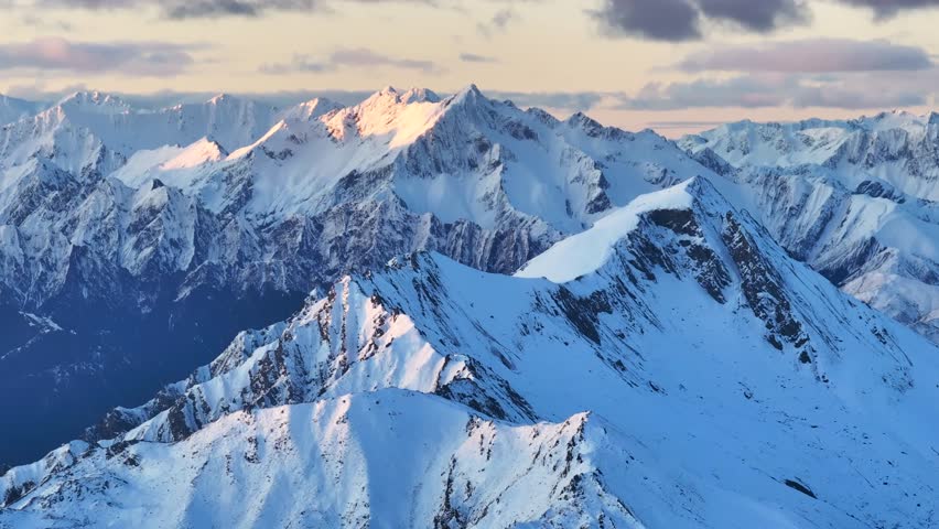 Impressive high mountain peaks of Southern Alps. Winter snowy natural landscape, New Zealand - aerial