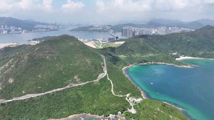 Sai Kung Clear Water Bay Beach in Hong Kong is a serene coastal destination with crystal-clear waters and golden sandy shores. perfect for swimming water sports sunbathing and picnicking